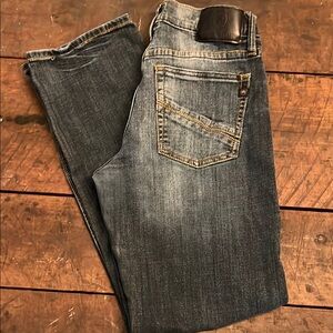 Rock & Republic Blue Jeans with Distressing and Vintage Look.